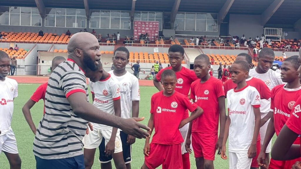Coach Ejike Uzoenyi with his players during a training session